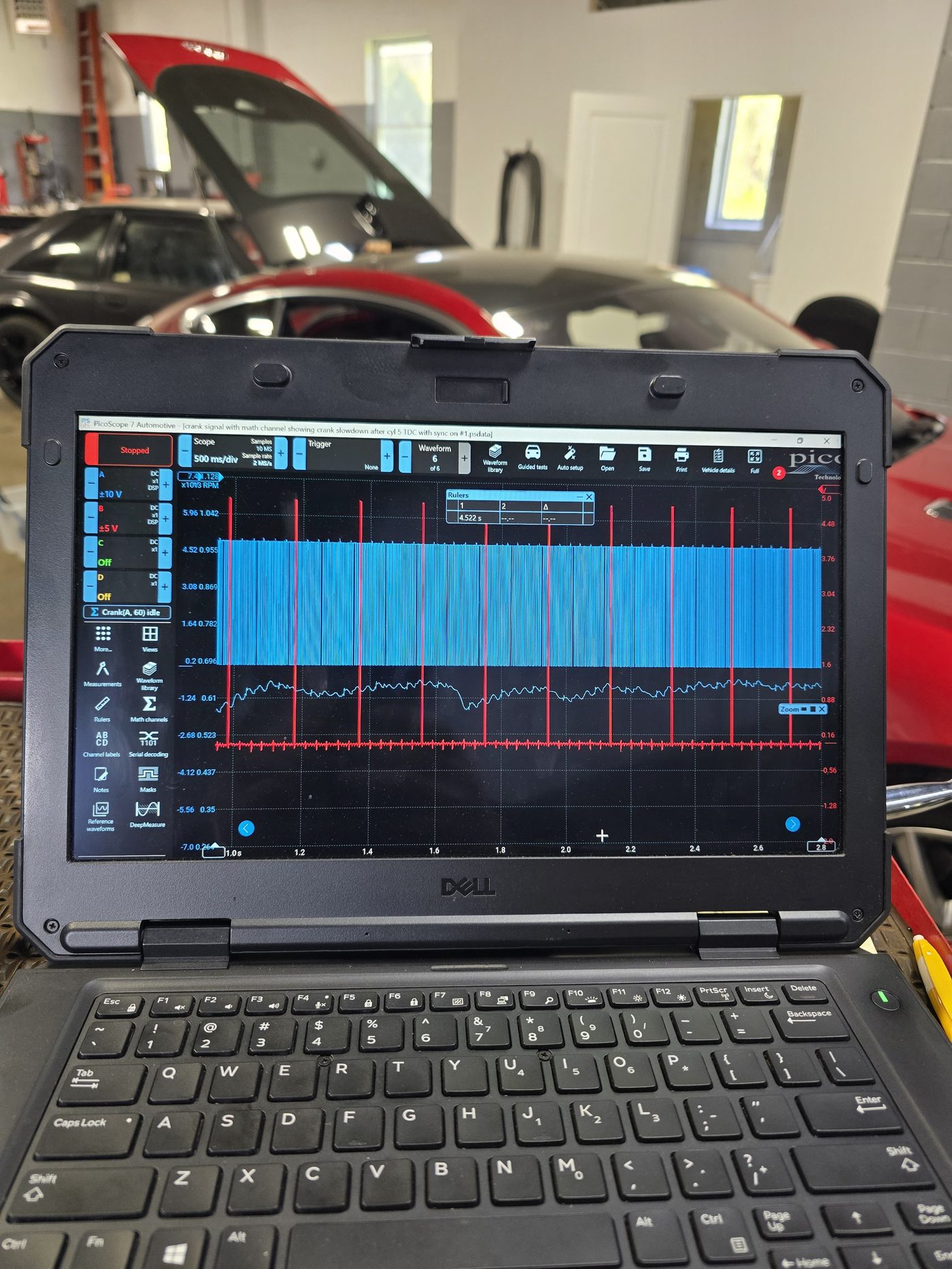 Oscilloscope waveform analysis on a lab scope during advanced vehicle diagnostics in the shop